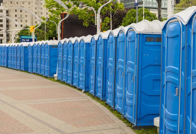 a row of portable restrooms at a fairground, offering visitors a clean and hassle-free experience in Marianna