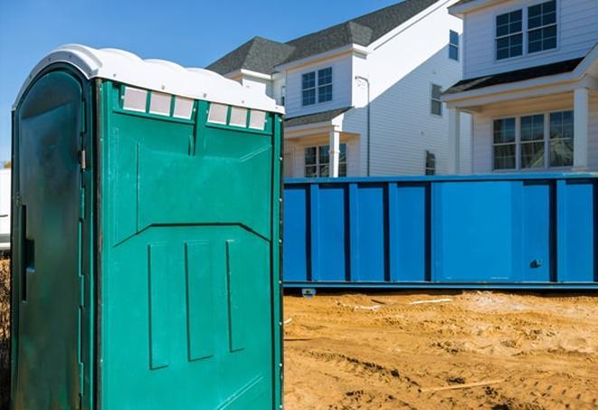 a porta potty lineup at an active work site